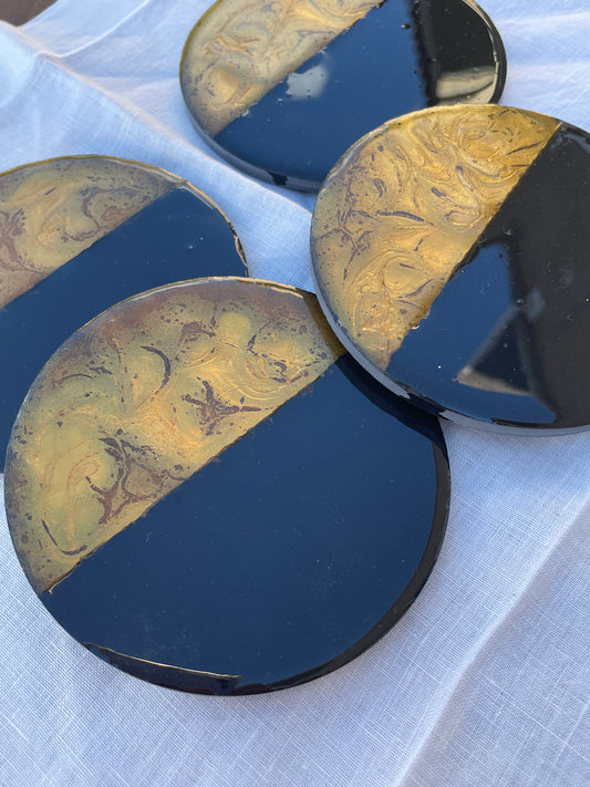 Posavasos redondos de pizarra y resina.