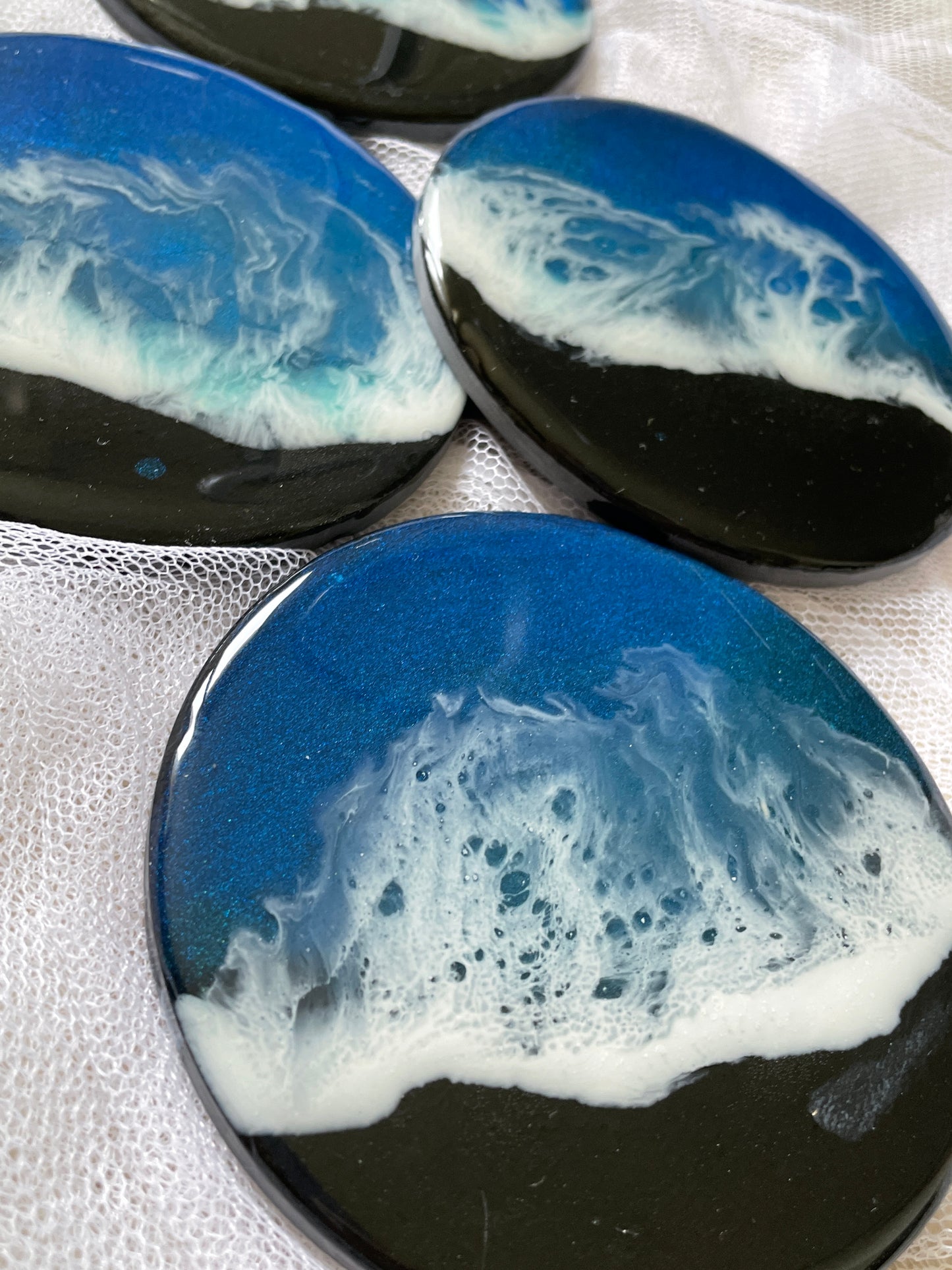 Posavasos redondos de pizarra y resina.